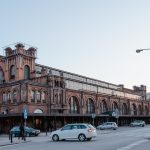 <h1>Privacy-Preserving Optimal Transport for Autonomous Vehicles: Balancing Intelligence and Anonymity</h1> Historic urban building with classic design in city center, surrounded by street and traffic.