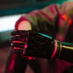 <h1>Quantum-Enhanced Soft Robotics: Navigating the New Frontier of Neuroethics</h1> A close-up view of a futuristic bionic prosthetic arm in neon lighting.