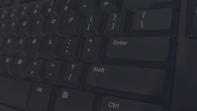 Detailed shot of black computer keyboard showcasing various keys for technology concepts.