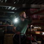<h1>Robust-to-Distribution-Shift In-Situ Resource Utilization (ISRU) for Complex Systems</h1> A dedicated worker organizing inventory on warehouse shelves with focused concentration.