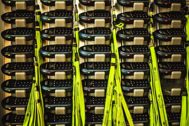 Electronic devices neatly organized in storage with charging cables for efficient management.