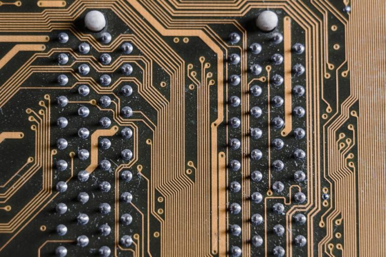 Detailed view of the intricate lines and solder points on a printed circuit board.