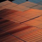 Close-up view of solar panels reflecting sunset light, illustrating renewable energy technology.