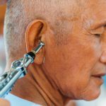<h1>Self-Healing Closed-Loop Neurostimulation: The Future of Synthetic Media Interaction</h1> Close-up of a senior man getting an ear acupuncture treatment for relaxation and wellness.