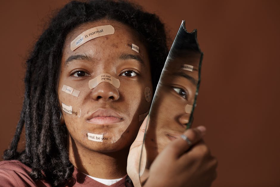 A powerful portrait of a woman embracing imperfections with positive messages on her face, holding a broken mirror.