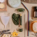 Self-Healing ISRU: Sustainable Deep-Space Exploration Guide Flat lay of sustainable beauty products featuring jade roller, menstrual cup, and reusable straws.
