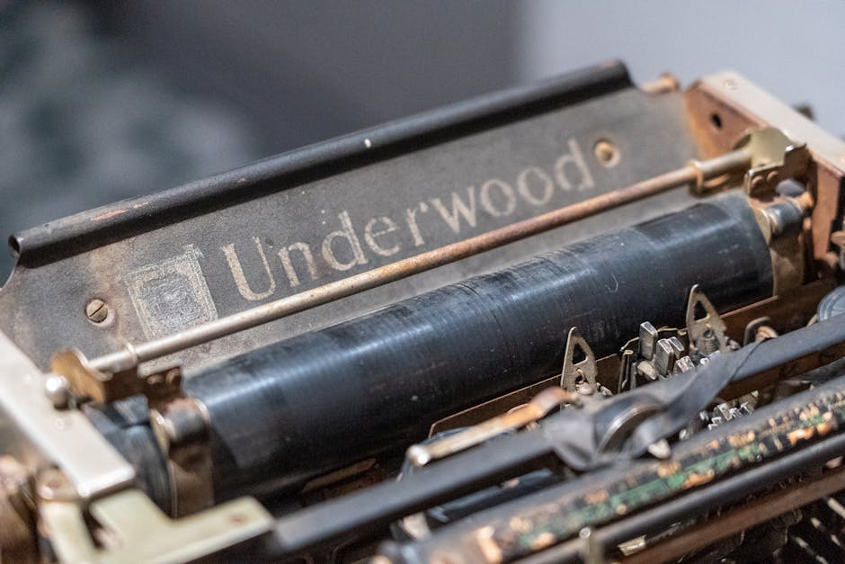 Detailed shot of an Underwood typewriter's mechanics, showcasing retro technology.
