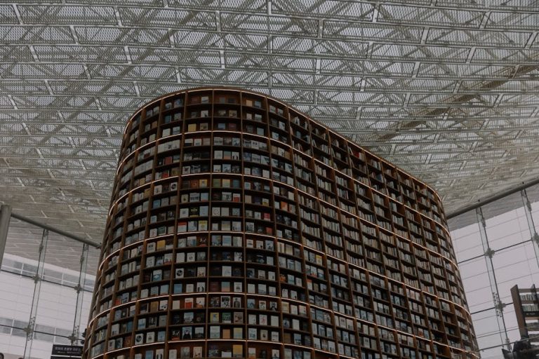 Discover the stunning design of a modern library with towering curved bookshelves.