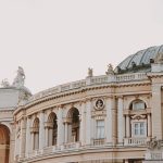 The Architecture of Influence: How Storytelling Controls Markets Elegant architecture featuring a dome and arches, with intricate sculptures and statues.