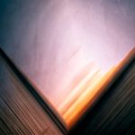 Ethereal abstract image with vibrant colors and geometric lines creating depth and motion.