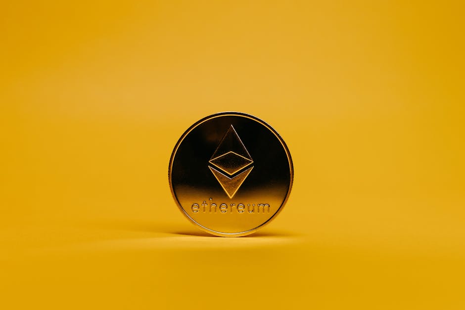 A shiny Ethereum coin displayed on a vibrant yellow background, symbolizing cryptocurrency.