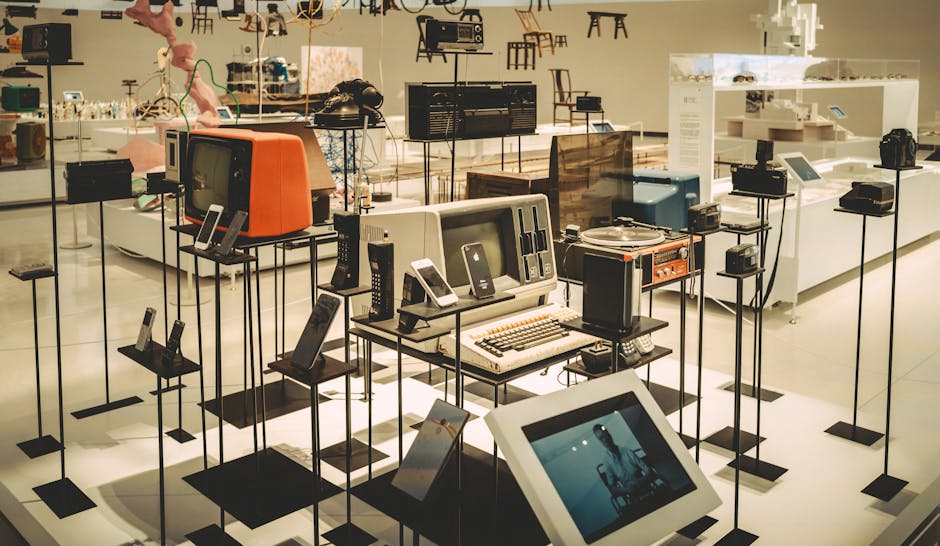 Showcase of vintage electronics in a modern museum setting.