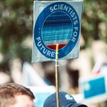 Protesters in Nuremberg advocate for climate action with 'Scientists for Future' signs.