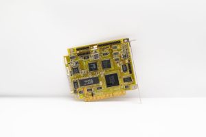 Antique circuit board showcasing vintage computing technology, isolated on a white background.