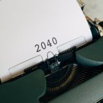 Close-up of a vintage typewriter with a paper showing the year 2040, capturing a nostalgic yet futuristic feel.