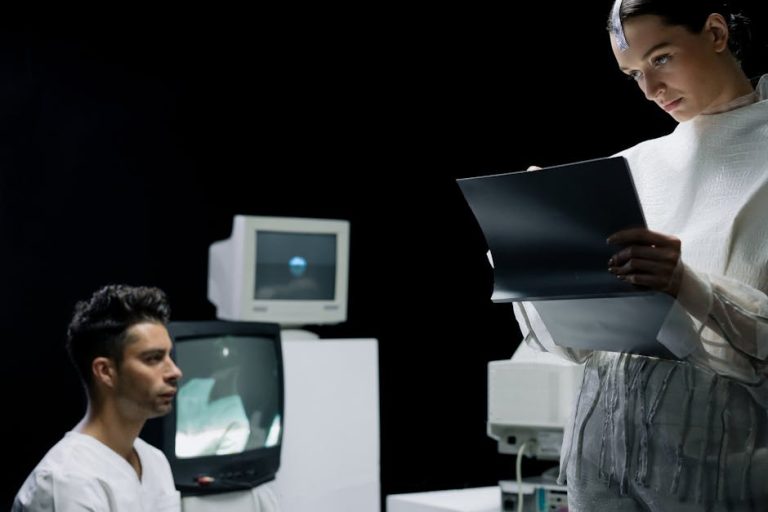 A futuristic lab with scientists reviewing a digital screen and data.