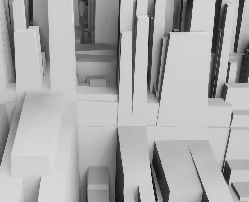 Aerial view of a 3D abstract cityscape with geometric shapes in grayscale tones.