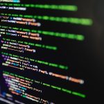The Green Compiler: Eco-Friendly Cybersecurity for IoT High-resolution image of colorful programming code highlighted on a computer screen.