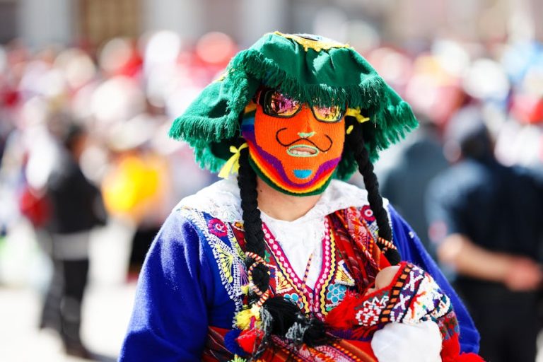A vibrant dancer with a mask at a traditional festival in Cusco, Peru.