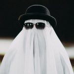 The Invisible Variable: How Cultural Identity Shapes Scientific Inquiry A funny depiction of a ghost wearing a black hat and sunglasses, perfect for Halloween.