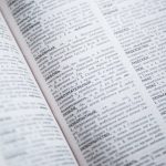 The Linguistic Architecture of Innovation: How Language Shapes Strategy Close-up view of an open Russian dictionary showing detailed text and entries.