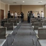 Business professionals networking in a conference room setting.
