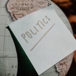 The Politics of Success: Strategy and Execution in Public Power A close-up of a globe with a politics sticky note, symbolizing global political themes.