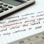 The Price of Progress: Solving Ethical Dilemmas in Innovation Focused image of handwritten business notes with calculator emphasizing pricing strategy.