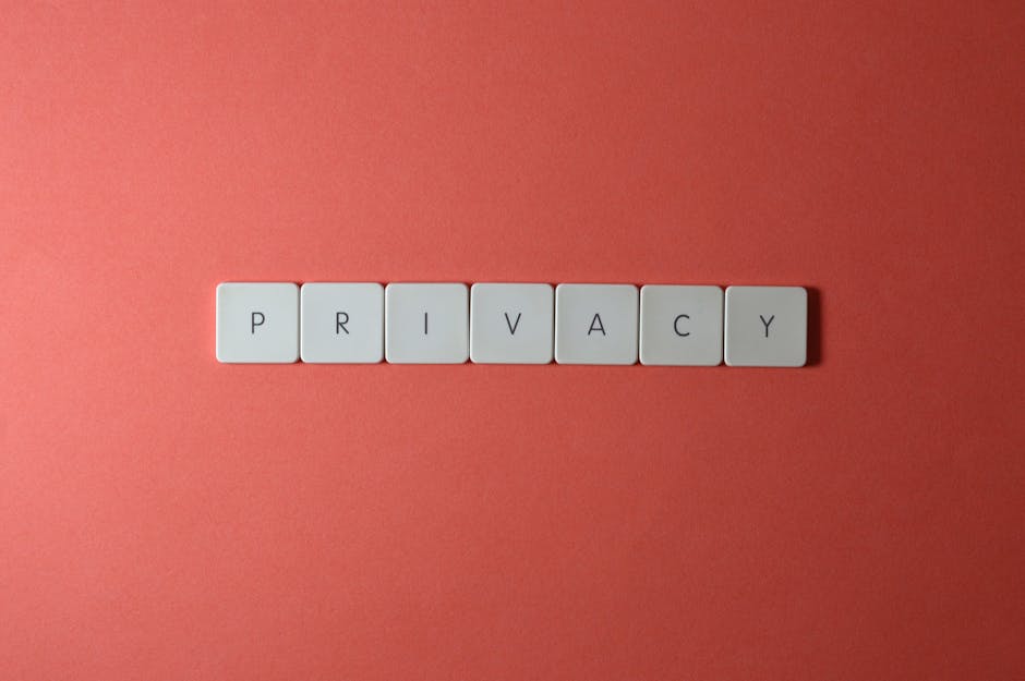 Close-up of letter tiles spelling PRIVACY on a red background, symbolizing data protection.