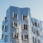 Striking modern building facade reflecting sunlight in Düsseldorf, Germany.