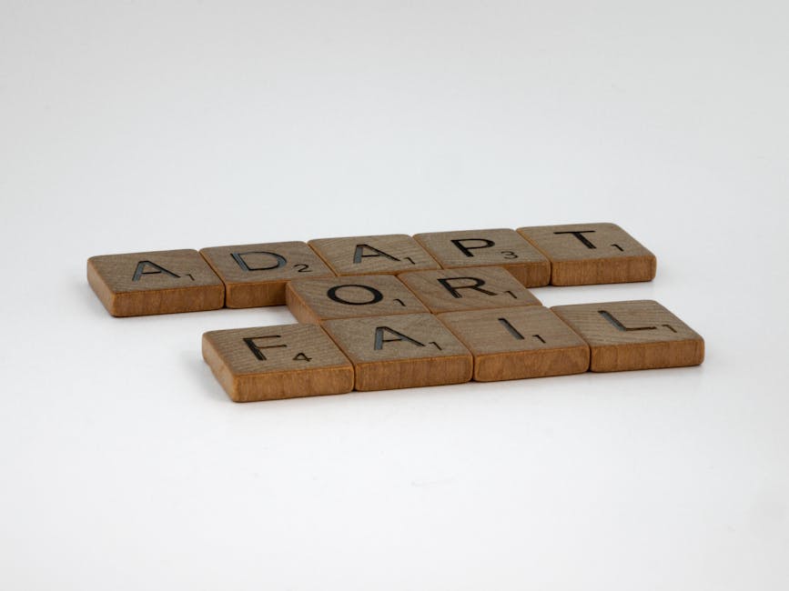 Scrabble tiles spelling 'Adapt or Fail' on a plain background, symbolizing decision-making.