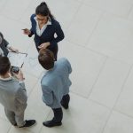 The Strategic Architecture of Corporate Resilience Group of business professionals collaborating in an office setting.