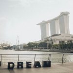 Scenic view of Marina Bay Sands with 'Dream' sculpture at Singapore waterfront.