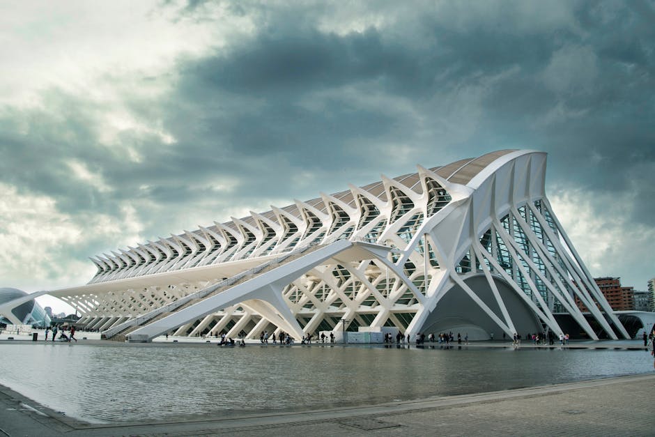 Stunning architectural design at the City of Arts and Sciences in Valencia, Spain with a dramatic sky backdrop.