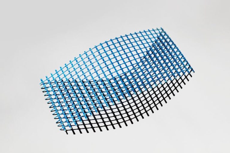 Dynamic abstract grid with blue and black colors on a white background.