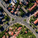 Aerial view of a bustling intersection in Plovdiv, Bulgaria, showcasing urban architecture.