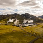 Topology-Aware Geoengineering for Climate Complexity Aerial view of Hellisheidi geothermal power plant with mountains and steam in Iceland