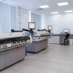 Trustworthy Molecular Machines: A Quantum Tech Blueprint Spacious laboratory interior featuring state-of-the-art machines and computers for research purposes.