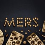 Verifiable Bioelectronic Medicine: Engineering Algorithms Artistic representation of healthcare with gold pills and syringes forming 'MERS' on a black background.