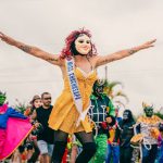 Why Cultural Identity is the Missing Variable in Futurism Vibrant carnival with performers in colorful costumes and masks in San Martín, Perú.