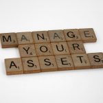Why Privacy is a Strategic Asset, Not Just a Compliance Burden Wooden tiles spelling 'Manage Your Assets' offer conceptual business advice.