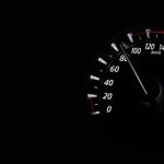 Speedometer reading showing speed in km/h on a dark background.