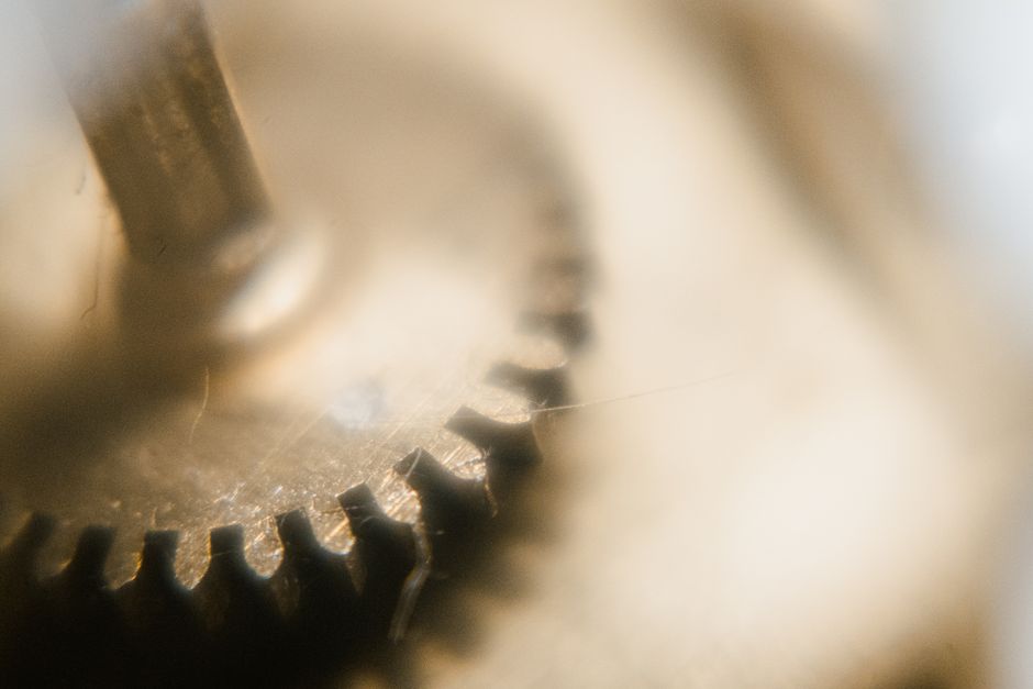Detailed macro view of watch gear showcasing precision engineering and components.