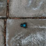 Agricultural Drones: Scaling Crop Yields with Autonomous Data Drone shot of a blue tractor on geometric salt flats, showcasing farming in a unique landscape.