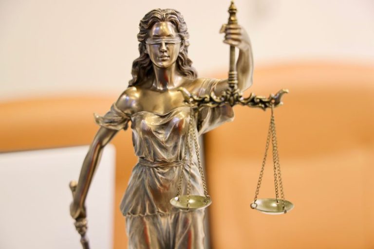 Detailed image of Lady Justice statue, symbolizing fairness and impartiality.