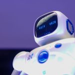 Automated Arbitration: The Future of Legal Operational Efficiency A modern humanoid robot with digital face and luminescent screen, symbolizing innovation in technology.