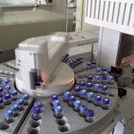 High-tech laboratory equipment with multiple vials in a scientific research facility.