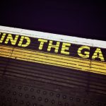 Avoiding the Reality Gap: Leadership Lessons from History Bold 'Mind the Gap' text on a subway platform, emphasizing passenger safety.