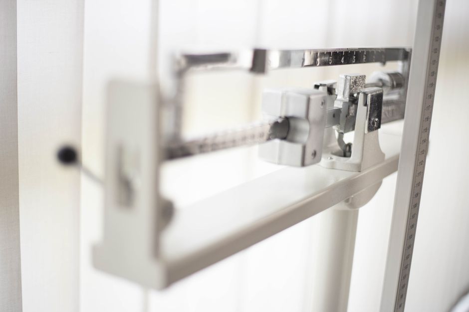 Detailed view of a classic mechanical balance scale, offering precision in weight measurement.