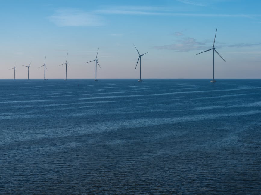 Scenic view of offshore wind turbines against a calm sea in Flevoland, promoting renewable energy.